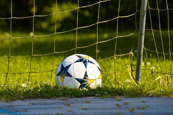 pexels-photo-3999307 white soccer ball on green grass field